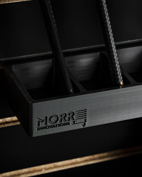 Close-up of 3D printed slatwall arrow holder showing Morr Innovations logo